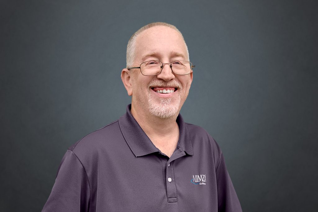 Headshot of BJ Yoder in glasses smiling